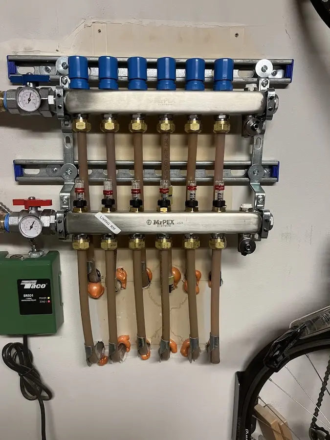 Plumber performing Water Heater Repair at a residential property in Baldwin