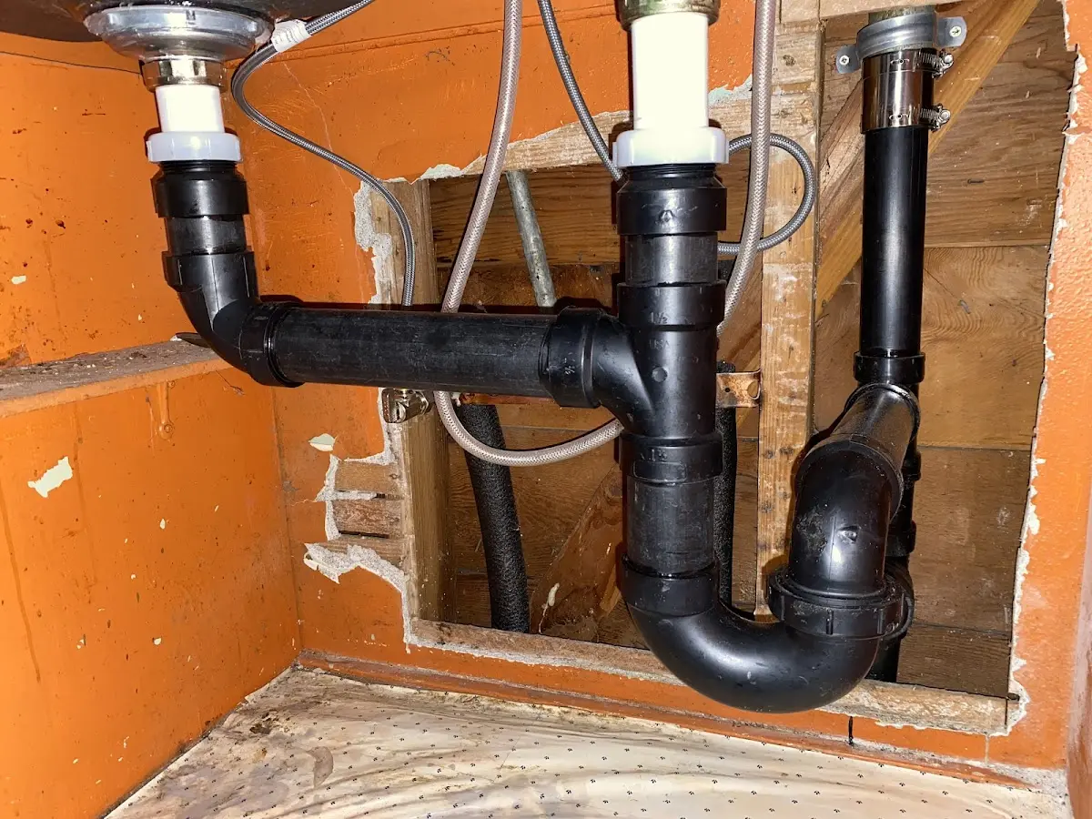 Professional Garbage Disposal Repair equipment and tools on the job in Baldwin